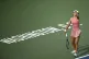 Emma Raducanu, of Britain, serves to Marta Kostyuk, of Ukraine, during a match at the Citi Open tennis tournament Tuesday, July 22, 2025, in Washington