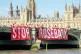 Activists drop a ‘Stop Rosebank’ banner on Westminster Bridge