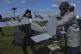 A manufacturer demonstrates a Ukrainian made drone at a Ukraine Defence Innovations exhibition for military clients on an undisclosed location in Ukraine, April 11, 2025