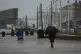 A man takes shelter from the wet weather beneath an umbrella as he walks along the promenade in Blackpool, Lancashire, August 4, 2025