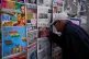 A man reads the newspaper front pages after the Bolivian election