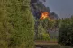 Smoke and flames rise following powerful explosions after several rail cars loaded with liquefied gas caught fire in the suburbs of Vilnius, Lithuania, September 10, 2025