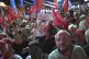 A supporter of Turkey's main opposition Republican People's Party or (CHP) kisses a image of former Istanbul Mayor Ekrem İmamoglu during a party rally, in Istanbul, Turkey, September 10, 2025