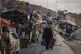 Displaced Palestinians fleeing northern Gaza carry their belongings along the coastal road toward southern Gaza, Septemner 11, 2025, after the Israeli army issued evacuation orders from Gaza City