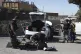 Members of the Israeli security forces work at the scene of a stabbing attack at a hotel in the Kibbutz Tzova, outside Jerusalem, Friday, Sept. 12, 2025