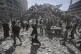 Palestinians examine the rubble of a building destroyed in an Israeli strike in Gaza City Monday, Sept. 15, 2025