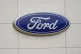 A view of a Ford logo on signage at Country Ford in Graham, N.C