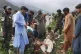Civil defense workers, locals, and army soldiers prepare to evacuate injured victims of an earthquake that killed hundreds and destroyed numerous villages in eastern Afghanistan, in Mazar Dara, Kunar province, September 1, 2025