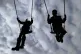 Children playing on swings in a park near Ashford, Kent