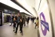 People use the Elizabeth Line service at Tottenham Court Road, London