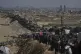 Displaced Palestinians flee northern Gaza along the coastal road toward the south, September 16, 2025
