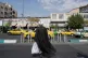 A cleric crosses the Enqelab-e-Eslami (Islamic Revolution) street, in Tehran, Iran, September 27, 2025