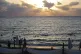 Syrian bathers swim as the sun sets at a beach resort in Wadi Qandil, north of the coastal city of Latakia, Syria, September 5, 2025