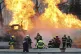 Firefighters spray hoses at a gas tanker that exploded under a highway overpass in Mexico City, September 10, 2025