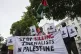 Protesters hold placards and flags during a demonstration held by the London Freelance branch of the National Union of Journalists to honour journalists killed in Gaza, opposite Downing Street in London, August 27, 2025