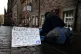 A homeless person and their dog on the Royal Mile in Edinburgh