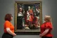 People look at ‘The Virgin and Child with Saints Louis and Margaret’ on display during a preview of the CC Land: The Wonder of Art exhibition in the refurbished Sainsbury Wing of the National Gallery in London