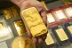 Sam Nguyen shows a gold bar at her shop in the St. Vincent Jewelry Center in the Jewelry District of Los Angeles, April 30, 2025