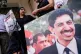 Maryam al-Khawaja holds a picture of her father, the imprisoned activist Abdulhadi al-Khawaja, outside the embassy of Bahrain in London, Sept. 15, 2023