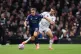 Arsenal's Leandro Trossard (left) and Fulham's Timothy Castagne battle for the ball during the Premier League match at Craven Cottage, London, October 18, 2025