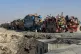 Afghan refugees sit beside trucks loaded with their belongings as they wait to leave for their homeland through a border crossing point on the outskirts of Chaman, Pakistan, October 29, 2025