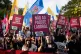 A demonstrator carrying a poster with the words ‘No to the labour package’ during a national protest against a new labour laws being prepared by the government, in Lisbon, November 8, 2025