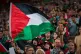 Fans wave Palestinian flags during a friendly match between a selection of Palestinian players and a group of Spanish players from the Basque Country, held to protest Israel's military actions in Gaza, in Bilbao, Spain, November 15, 2025