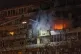 Firefighters put out the fire after a drone hit a multi-storey residential building during Russia's night drone attack in Kyiv, Ukraine, Tuesday, Nov. 25, 2025