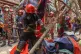 Rescue and fire officials cut building railings falling on the street to make way after an earthquake in Dhaka, Bangladesh, November 21, 2025