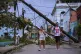 Pedestrians walk in Santiago de Cuba, October 29, 2025, in the aftermath of Hurricane Melissa
