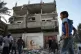 Palestinians inspect the damage to a house targeted by an Israeli strike in Deir al-Balah, in the central Gaza Strip, November 22, 2025