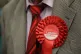 A man wearing a Labour rosette