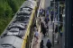 A general view of commuter disembarking a Great Northern railway train at Hunt's Cross station, Liverpool