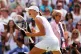 Iga Swiatek celebrates victory over Amanda Anisimova following the Ladies' Singles Final on day thirteen of the 2025 Wimbledon Championships at the All England Lawn Tennis and Croquet Club, London. Picture date: Saturday July 12, 2025