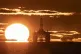 The sun rising behind a redundant oil platform moored in the Firth of Forth near Kirkcaldy, Fife, April 27, 2020