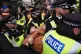 A person is carried away by police during a Defend Our Juries protest in support of Palestine Action outside the Ministry of Justice in central London, November 20, 2025