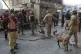 Army soldiers arrive with sniffer dogs after suicide bombers attacked the headquarters of the Federal Constabulary (FC), in Peshawar, Pakistan, November 24, 2025