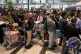 Passengers line up at an IndiGo Airlines ticket counter at the Rajiv Gandhi International Airport in Hyderabad, India, as several Indigo Airlines flights were either cancelled or delayed, Dececember 5, 2025