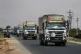 A convoy of vehicles loaded with food and other aid is en route to Sweida on the international highway in rural Daraa province, Syria, July 20, 2025, heading to the city of Busra al-Sham