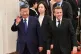 France's President Emmanuel Macron (right) and China's President Xi Jinping (left) walk during a state visit at the Great Hall of the People in Beijing, December 4, 2025