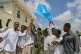 People raise Somalia's flag as they protest Israel's recognition of Somalia's breakaway region of Somaliland as an independent nation, in Mogadishu, Somalia, Tuesday, Dec. 30, 2025