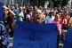 A supporter of Venezuelan President Nicolás Maduro displays a sign reading in Spanish 'We want our Nicolás' during a rally in Caracas, Venezuela, January 3, 2026
