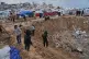 Palestinians inspect the damage at a displacement camp following an Israeli strike in Gaza City, January 9, 2026