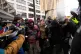 Jake Lang, center in the vest, who organized the March Against Minnesota Fraud, clashes with pro-immigration counterprotesters near Minneapolis City Hall, January 17, 2026, in Minneapolis