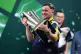 Luke Littler celebrates with the Sid Waddell trophy after victory against Gian van Veen after the final of the Paddy Power World Darts Championship at the Alexandra Palace, London, January 3, 2026