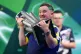 Luke Littler celebrates with the Sid Waddell trophy after victory against Gian van Veen after the final of the World Darts Championship at the Alexandra Palace, London, January 3, 2026