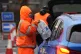 A worker hands over bottled water at a water station in East Grinstead, after bad weather was blamed for more water outages in Kent and parts of Sussex, January 12, 2026