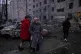 Local residents look at the multistory building that was damaged by Russia's air strike in Kramatorsk, Donetsk region, Ukraine, February 8, 2026