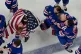 Team United States players celebrate after beating Canada 2-1 in overtime in the women's ice hockey gold medal game at the 2026 Winter Olympics, in Milan, Italy, February 19, 2026