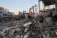 Civil defence workers survey the rubble of a police station after it was struck amid the joint U.S.–Israeli military campaign in Tehran, Iran, Monday, March 2, 2026